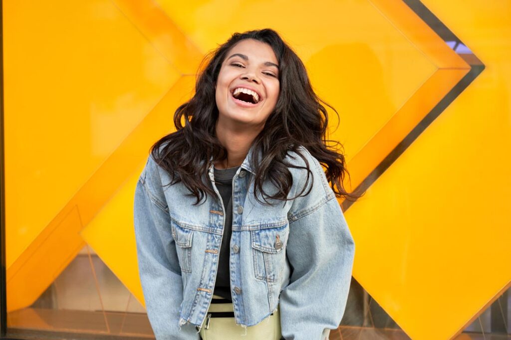 happy gen z woman thriving on an entry-level salary