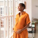a pregnant woman feeling contentment