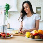 Woman cutting fruit
