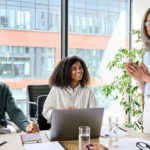 Boss having a team meeting with employees